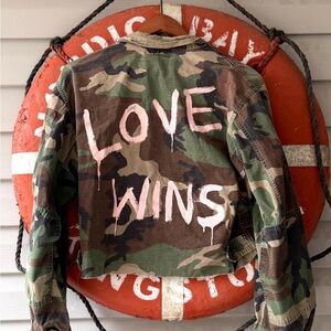 Camouflage Jacket with 'Love Wins' Design